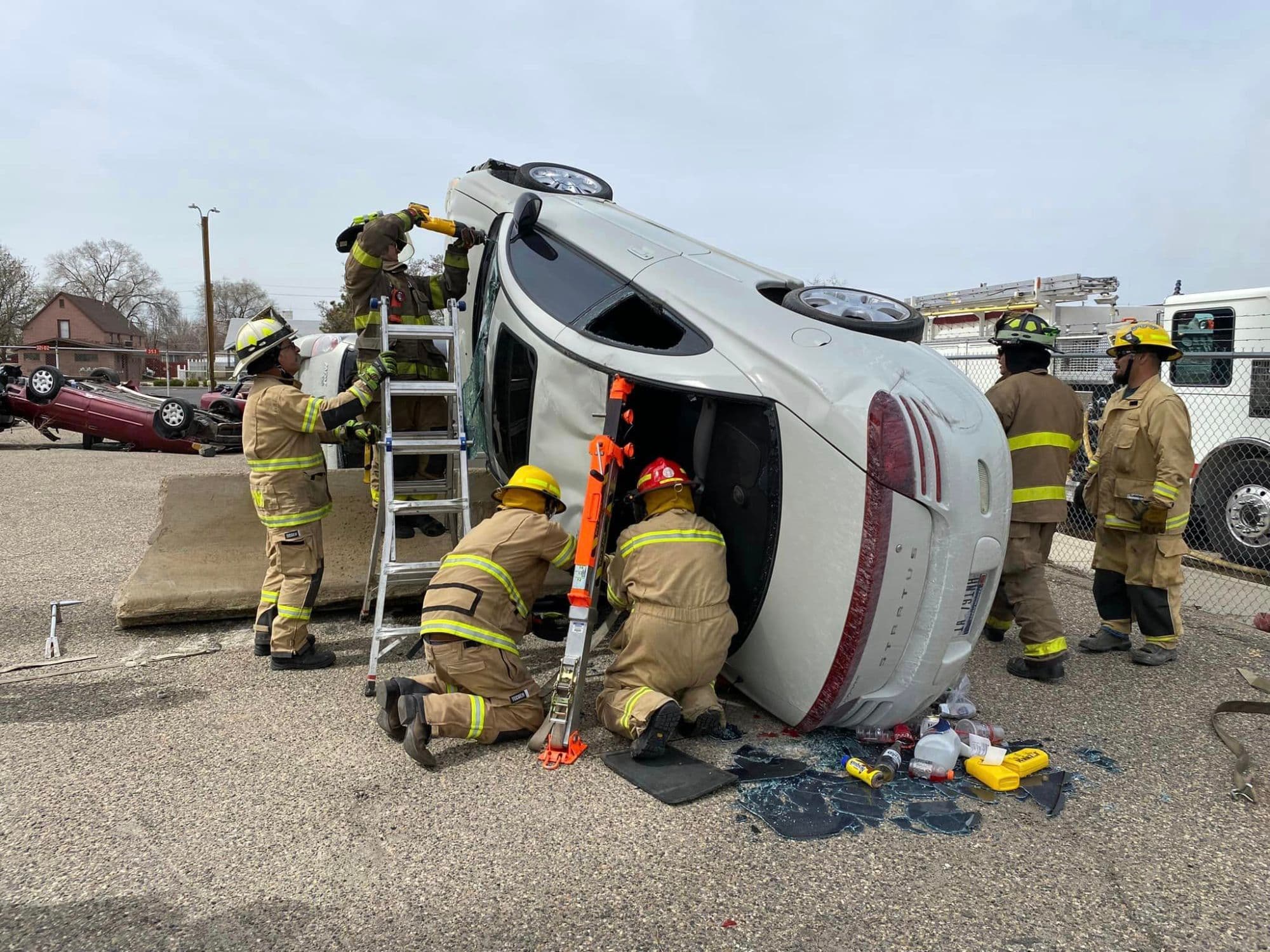 Payette firefighters performing a vehicle extrication with hydraulic tools
