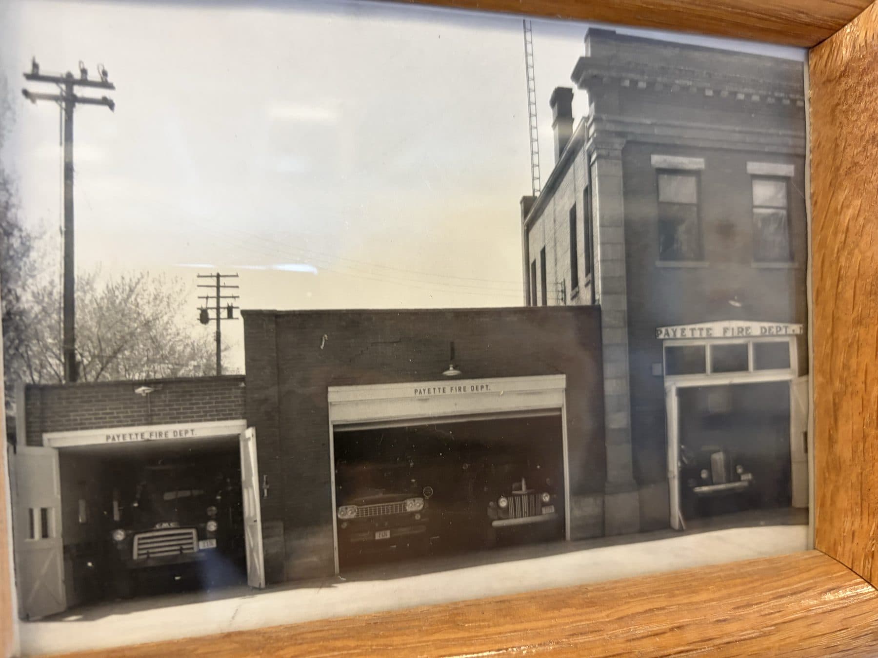 Vintage photo of the three-bay Payette Fire Dept. station with engines visible in each open bay